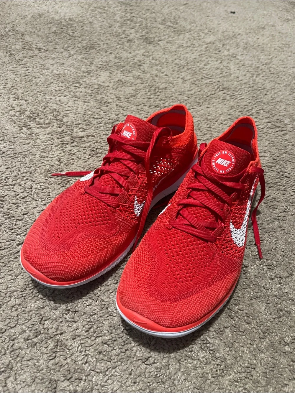 Nike Men’s Red Flyknit Sneakers with White Swoosh